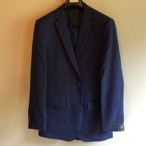38L men’s two-piece, two-button, navy blue suit. 100% polyester.
